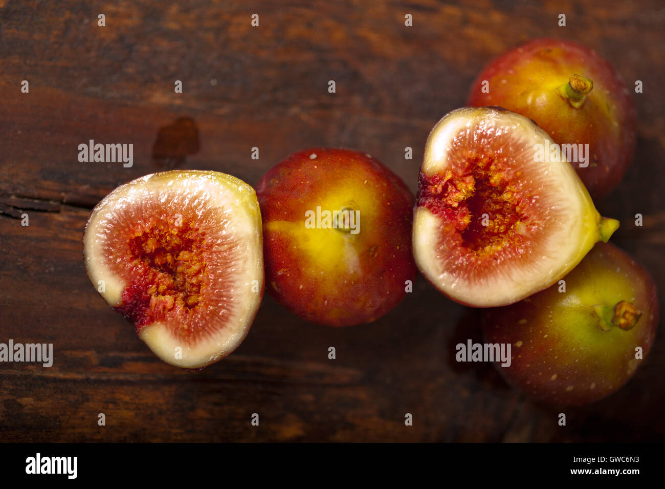 Over Ripped Figs fresh figs over old wood Stock Photo - Alamy