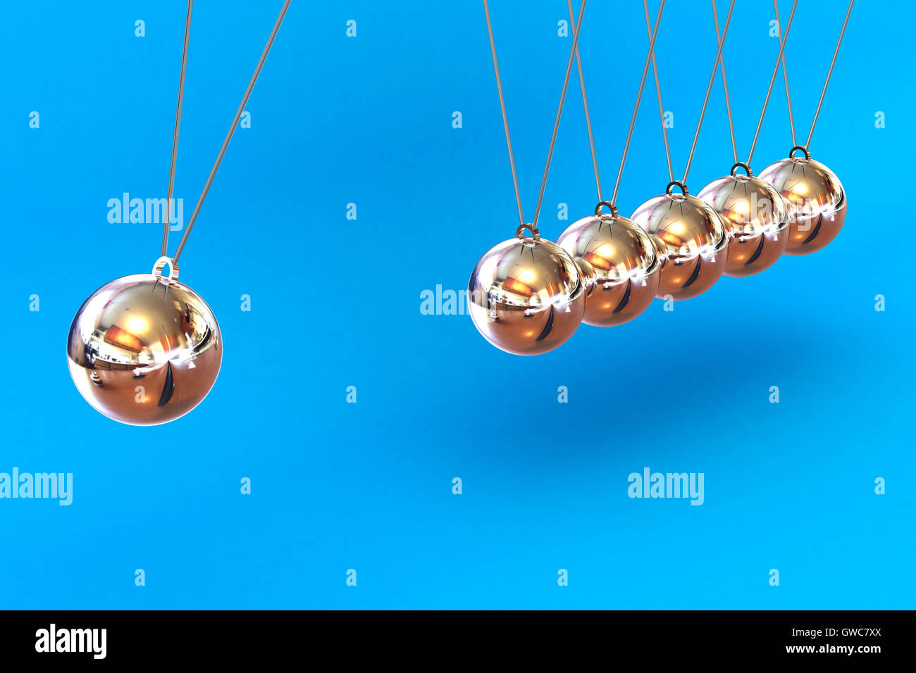 Newtons Cradle on a Blue Background Stock Photo Alamy