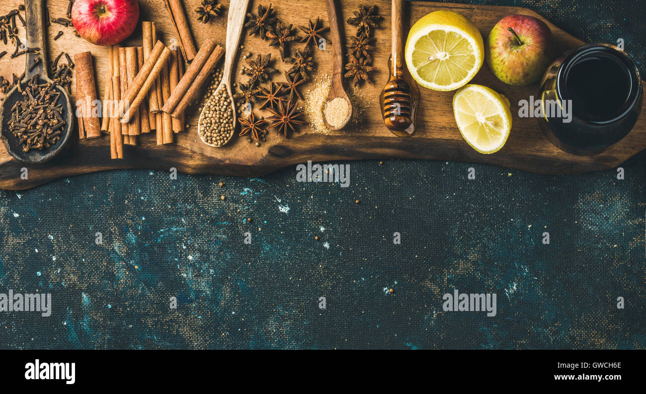 Ingredients for making mulled wine. Wine in glass bottle, honey, lemon