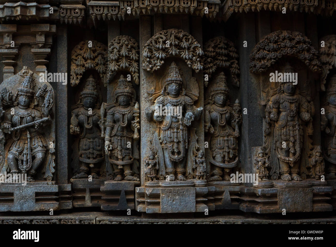 Deity sculpture under eves on shrine outer wall in the Chennakesava temple at Somanathapura, Karnataka,India, Asia Stock Photo