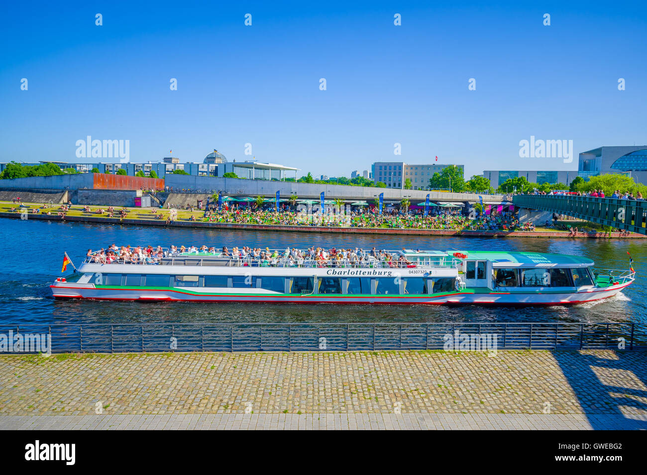 BERLIN, GERMANY - JUNE 06, 2015: Boat sailing trought a river in Berlin ...