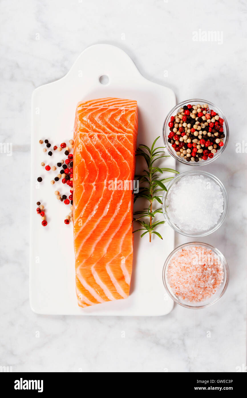 Delicious portion of fresh salmon fillet with aromatic herbs and spices