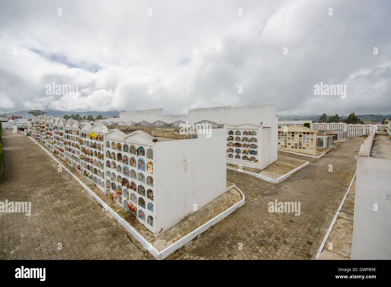 TULCAN, ECUADOR - JULY 3, 2016: overview of the city cemetery with lot of vertical graves and paths Stock Photo