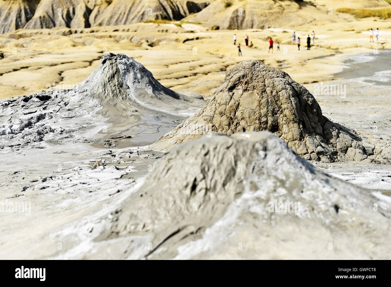 Landscape with mud volcanoes also known as mud domes erupting in summer Stock Photo