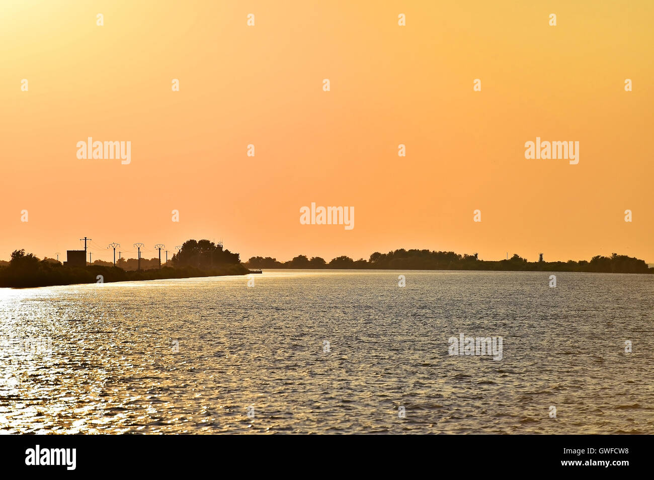 Sulina branch of the Danube river in Romania at sunset Stock Photo
