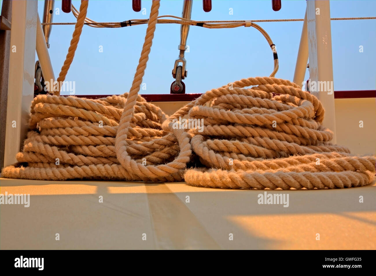 Coiled rope rigging on a sailboat deck Stock Photo - Alamy