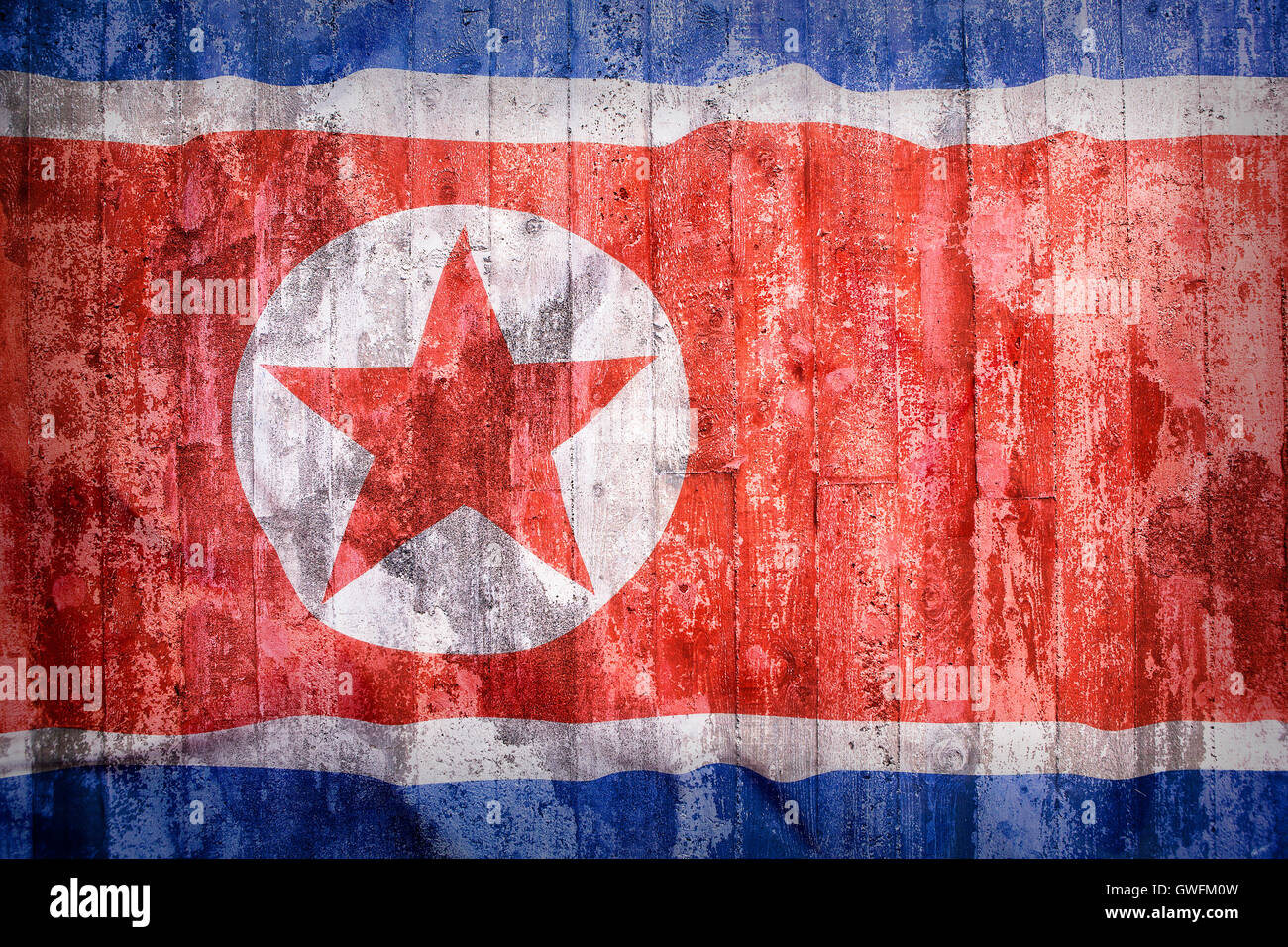 Grunge style of North Korea flag on a brick wall for background Stock Photo