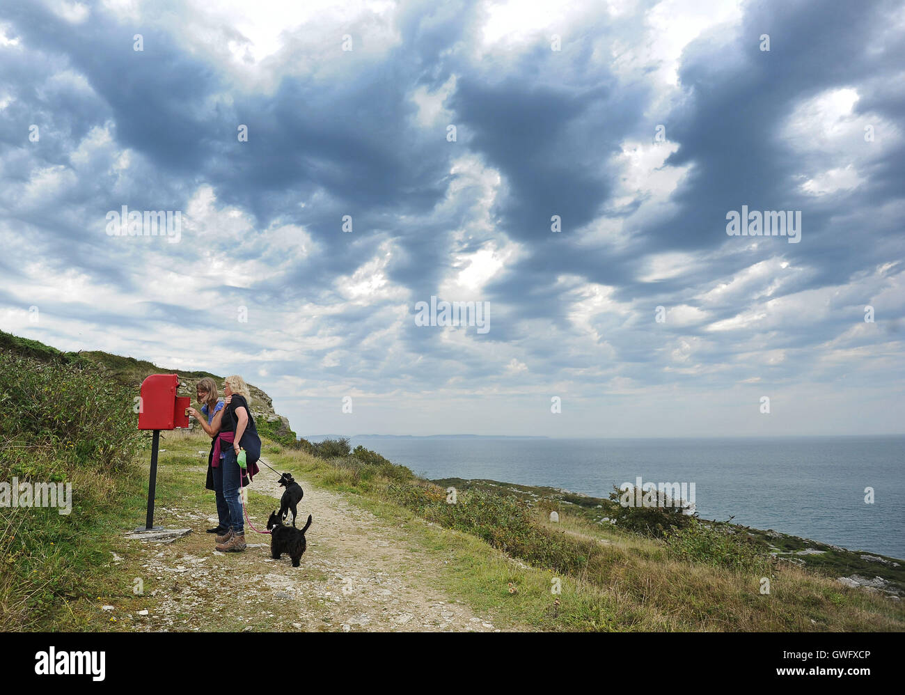 Portland, Dorset, UK. 13th September, 2016. Art installation on a cliffside 'Marrying the Land' by Katarina Rose. 'An unusually placed post box with a small golden key. Open it and find an illuminated world depicting an ancient custom of Portland, with a unique soundtrack' Credit:  Dorset Media Service/Alamy Live News Stock Photo