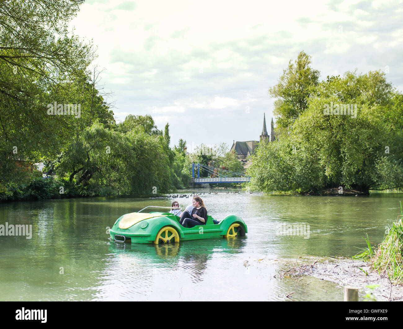 Leamington Spa, Warwickshire, UK. 13th September 2016. Girls ride a pedalo in the shape of a car on the River Leam. Temperatures were very high for the time of year. Credit:  Jamie Gray/Alamy Live News Stock Photo