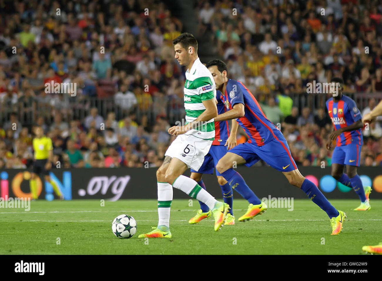 Nou Camp, Barcelona, Spain. 13th Sep, 2016. UEFA Champions League Football. Barcelona versus Celtic. Bitton in action challenged by Busquets. Credit:  Action Plus Sports/Alamy Live News Stock Photo