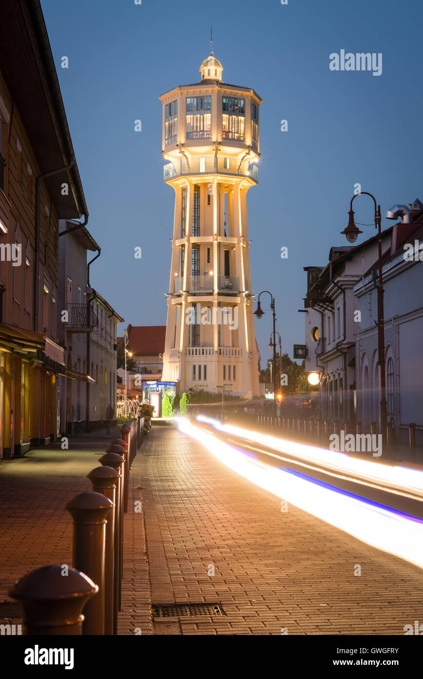 SIOFOK, HUNGARY - AUGUST 24, 2016: Old wooden water tower on main square of city Siofok with night illumination. Stock Photo