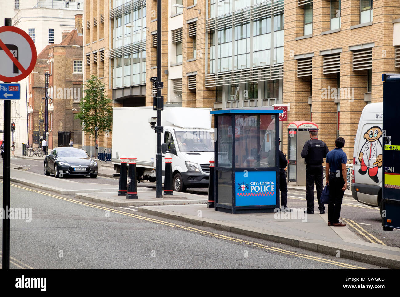 A City of London Police security checkpoint on Queen Victoria street. Stock Photo