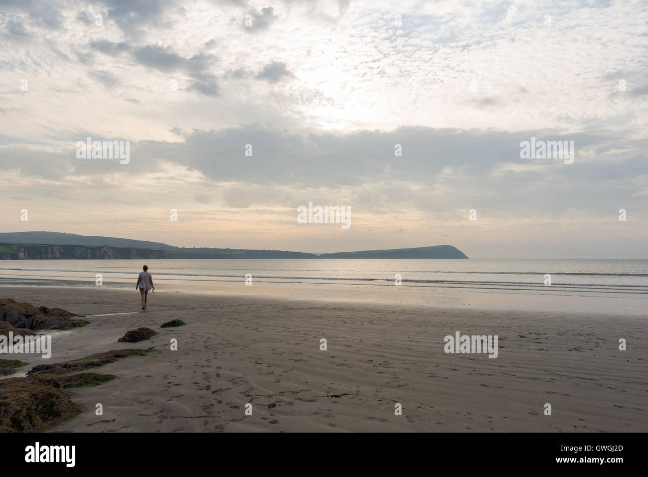 Sunset beach walk, Newport Sands, Pembrokeshire, Wales. Stock Photo