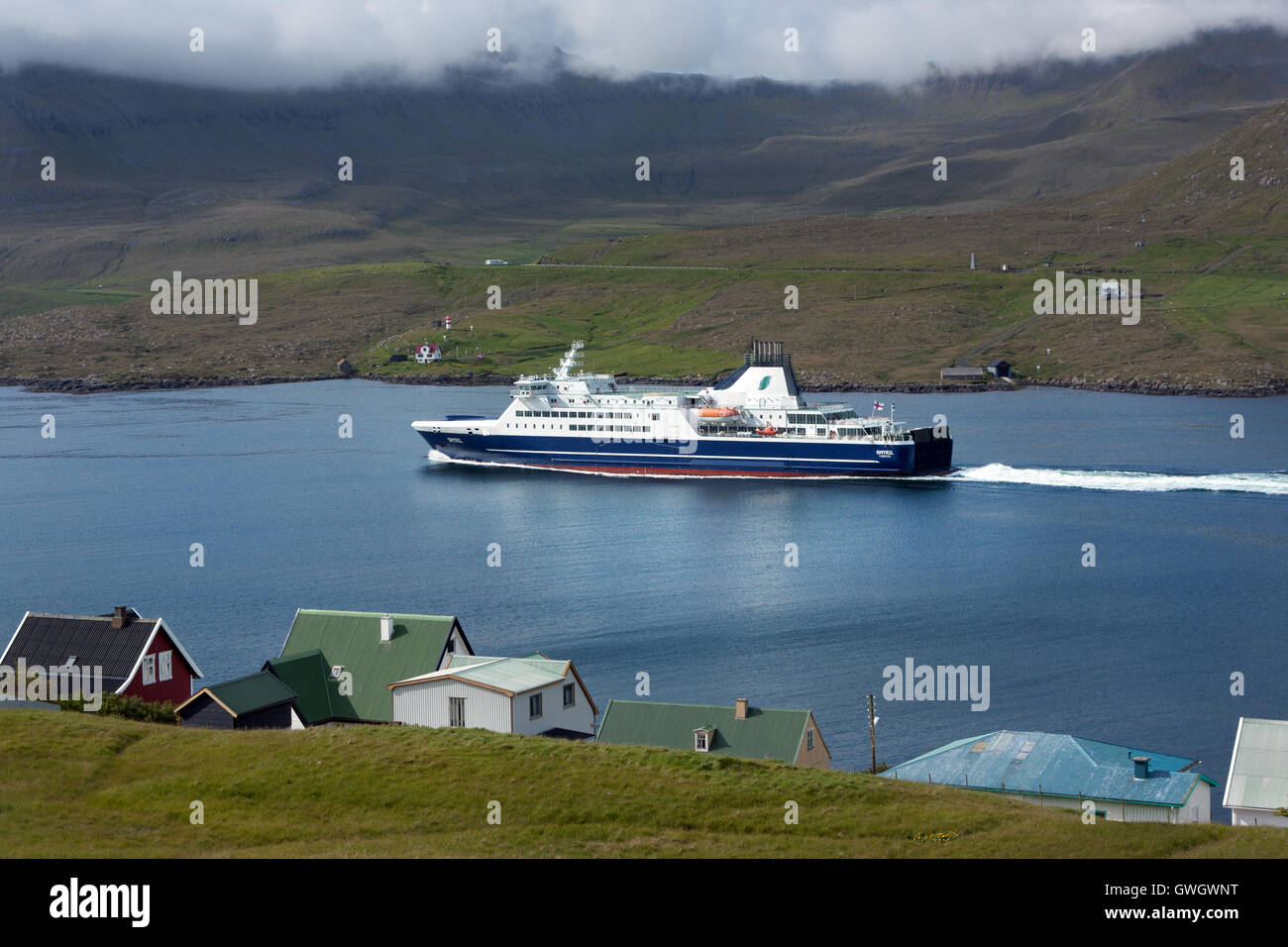 Suduroy, Faroe Islands - June 11, 2011 : Passenger Ferry sailing in a fjord on the route from Suduroy to Torshavn Stock Photo