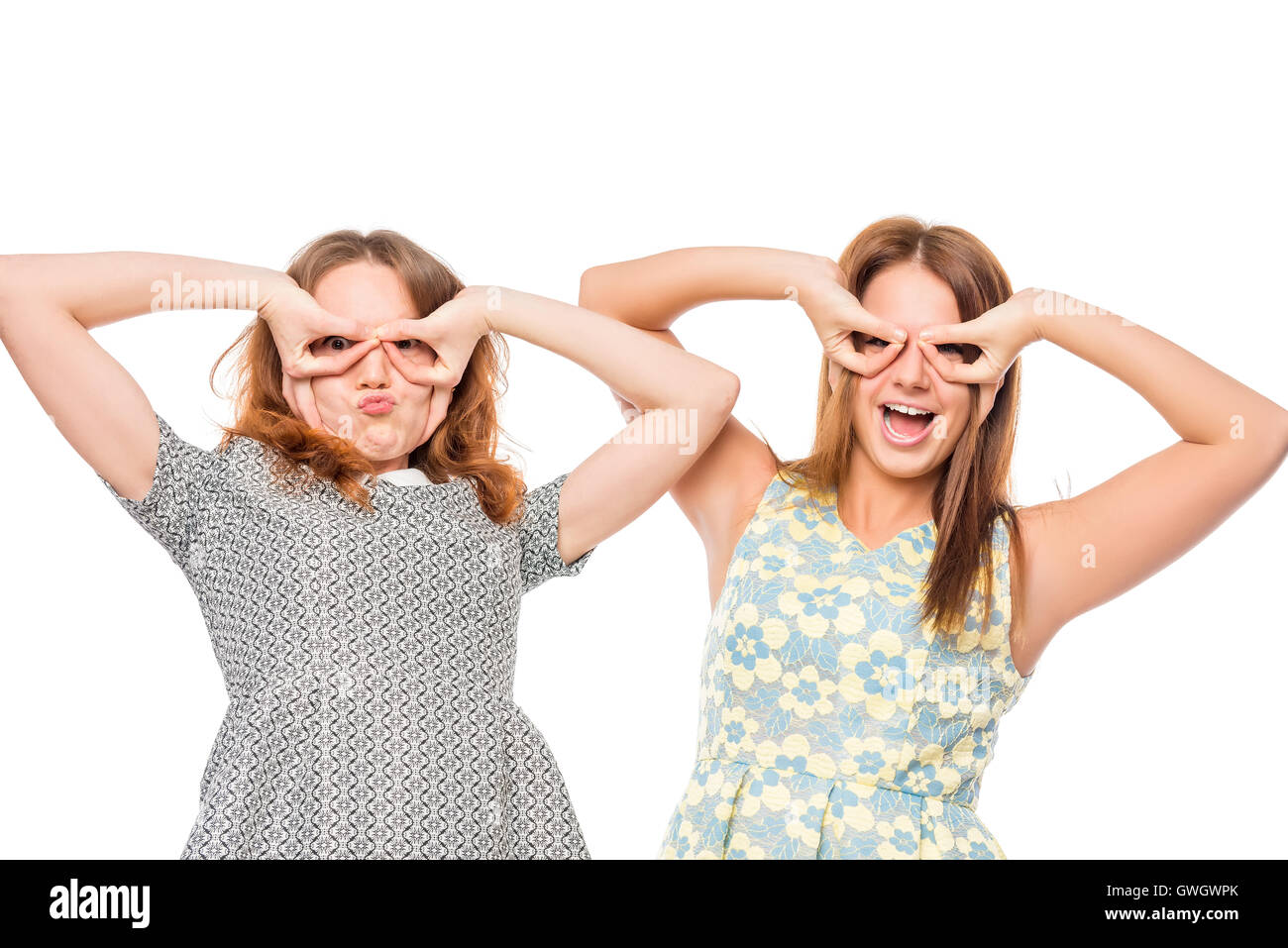 two friends with funny grimace on white background Stock Photo