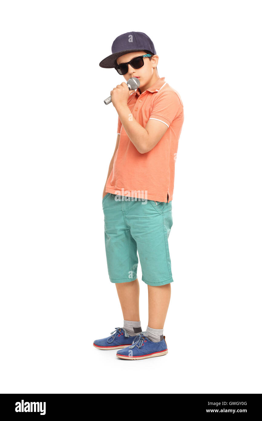 Young rapper posing with a microphone isolated on white background Stock Photo