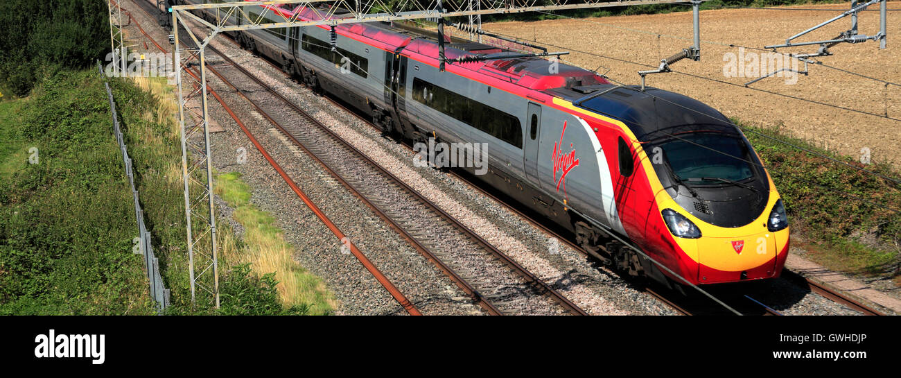 Virgin pendolino train rugby railway hi-res stock photography and ...