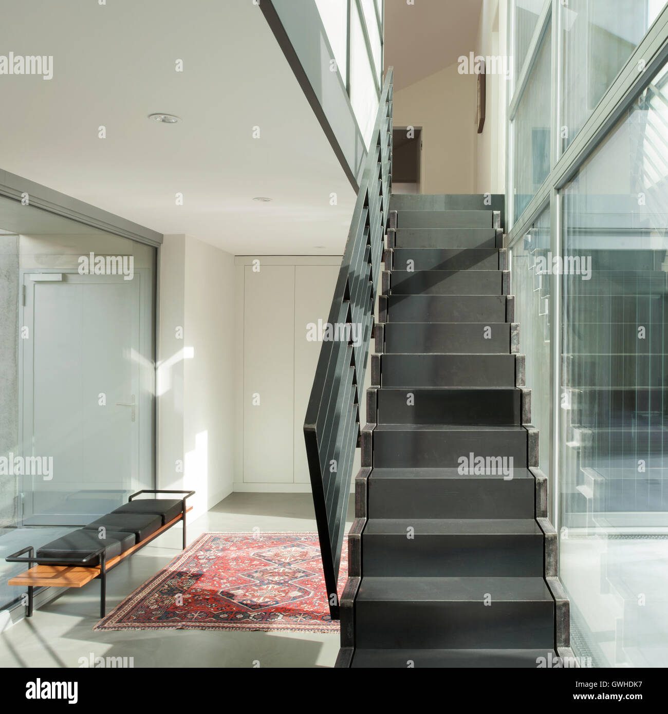 Interior of a modern house, hall with iron staircase Stock Photo