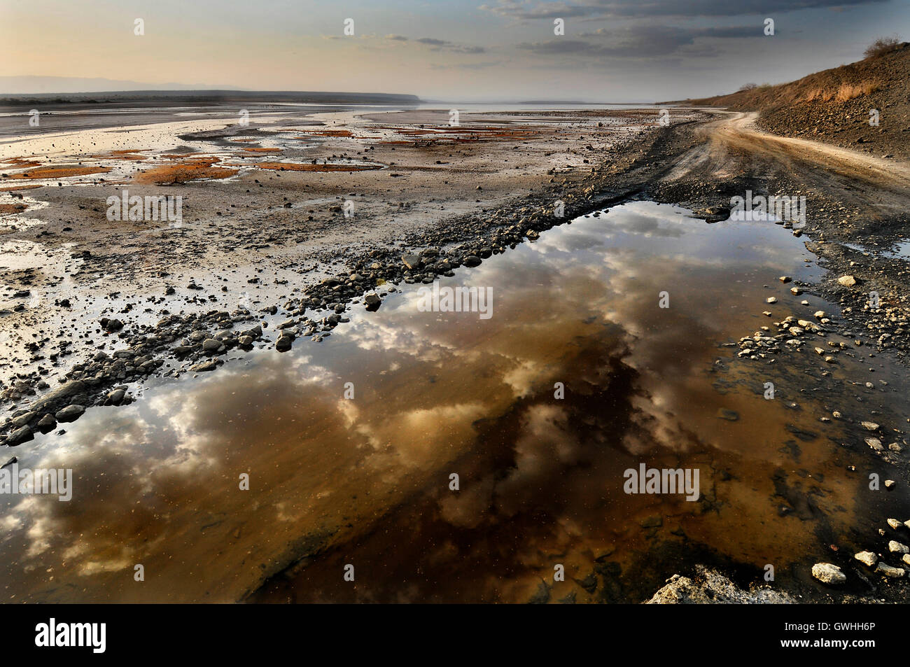Reflections of the sky in Lake Magadi, Kenya. Stock Photo