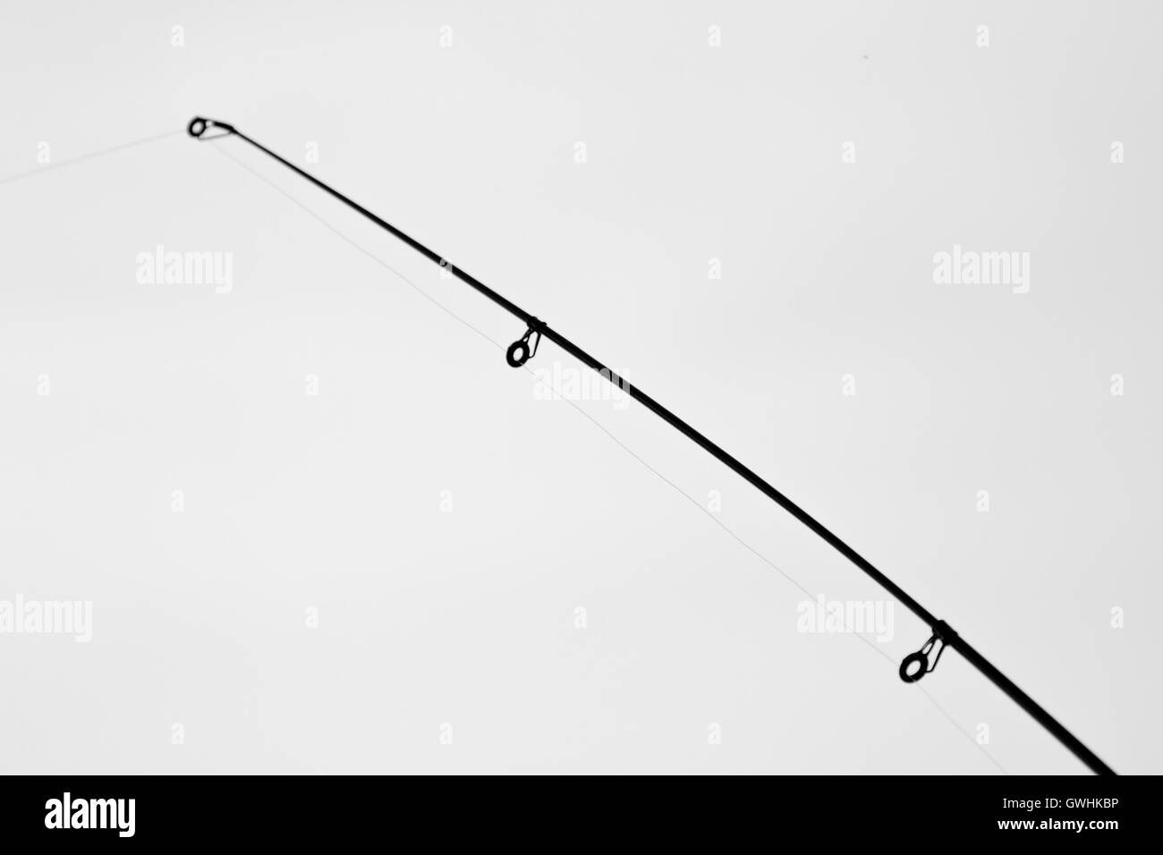 Fishing rod on black and white Stock Photo
