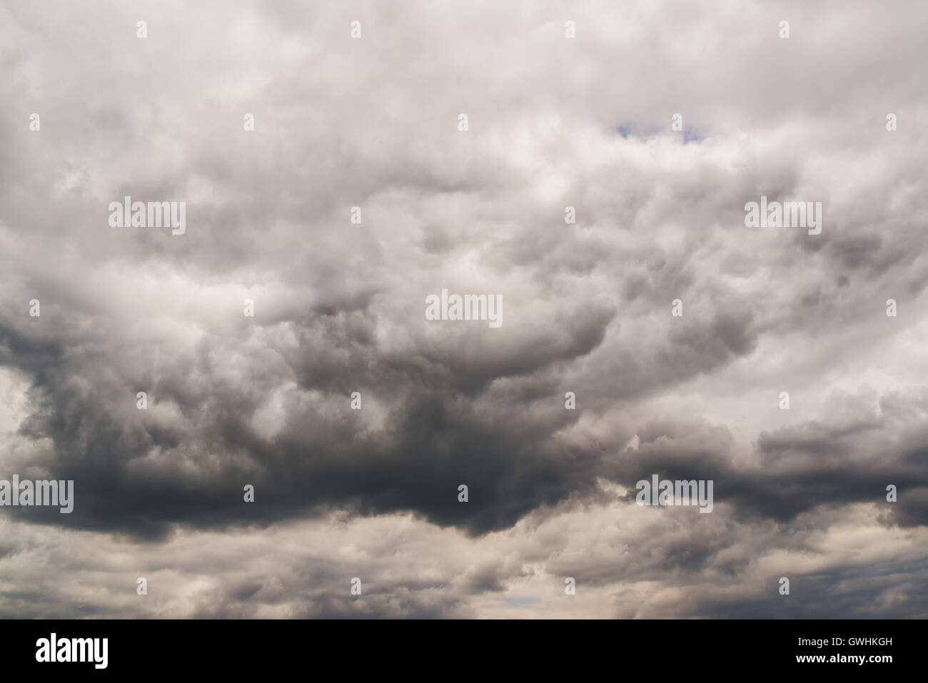 Dark and dramatic clouds in the sky, climate and weather changing background Stock Photo