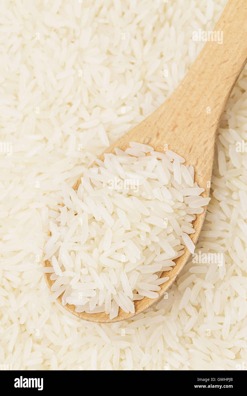 White rice and teaspoon Stock Photo Alamy