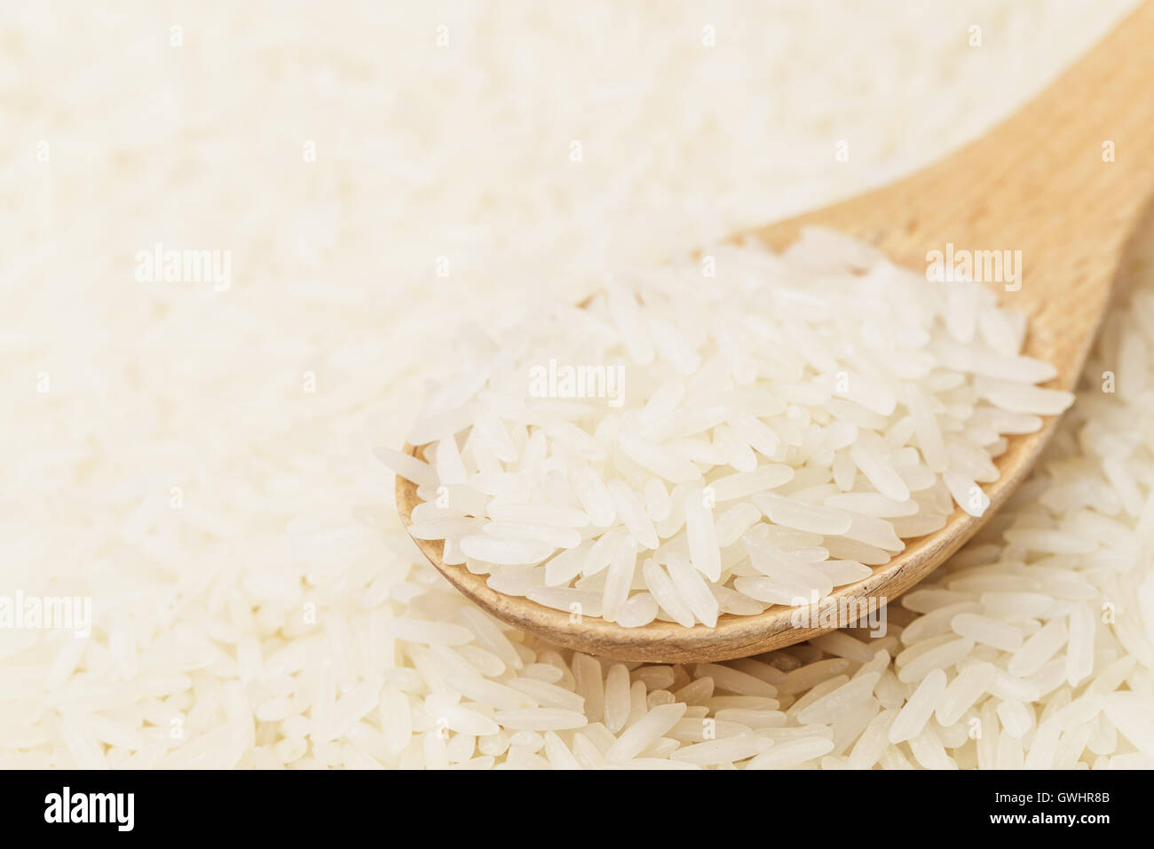 White rice on teaspoon Stock Photo Alamy