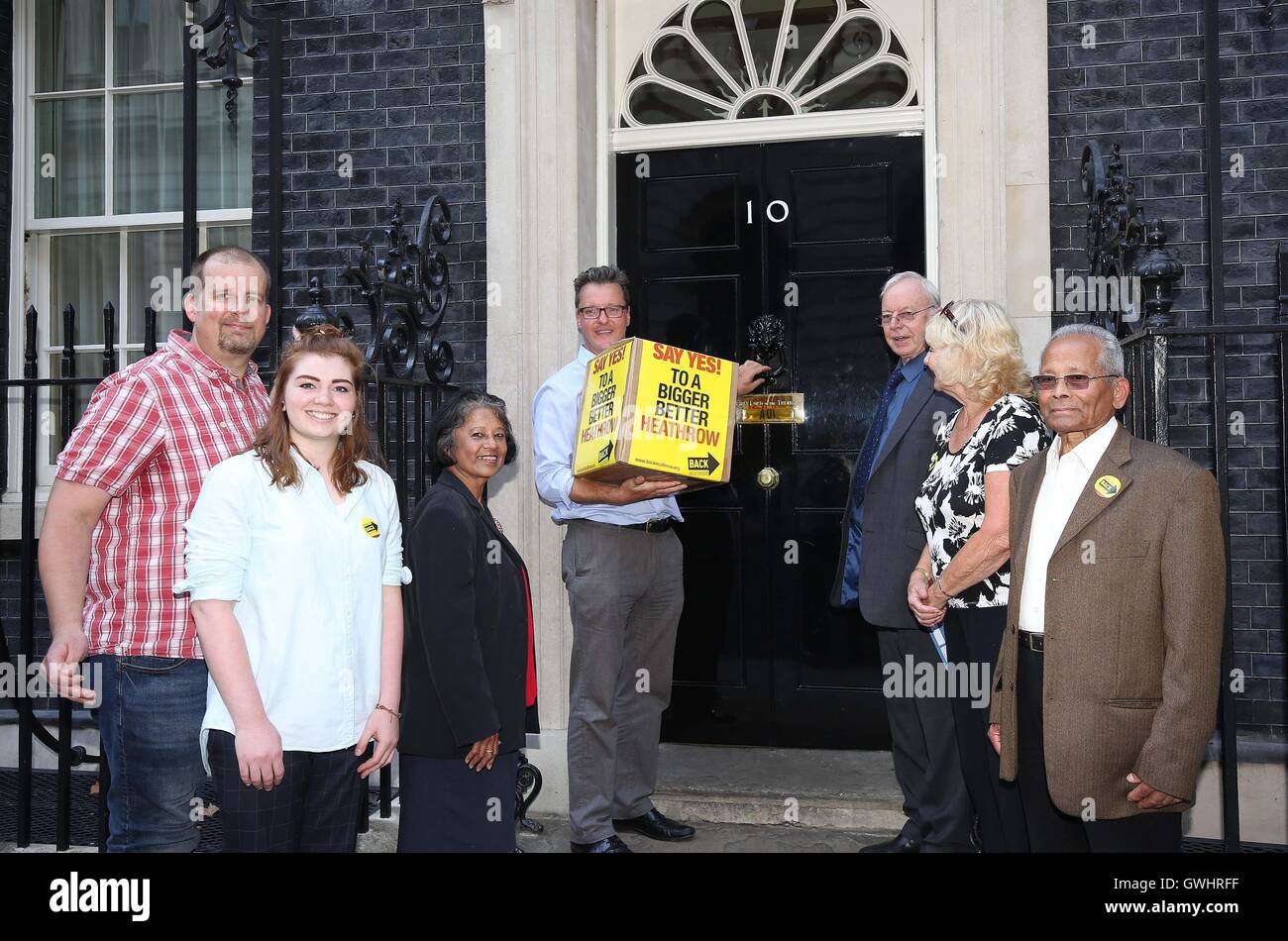 Campaign Director of Back Heathrow Rob Gray (centre) with Heathrow pro-expansion residents handing a petition into Downing St, they are urging the Prime Minster to get on and build the new runway at the airport. Stock Photo