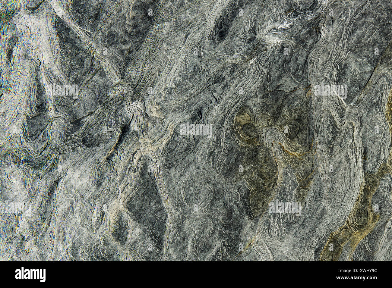Closeup view of marks, lines and patterns in the eroded surface rock. Stock Photo