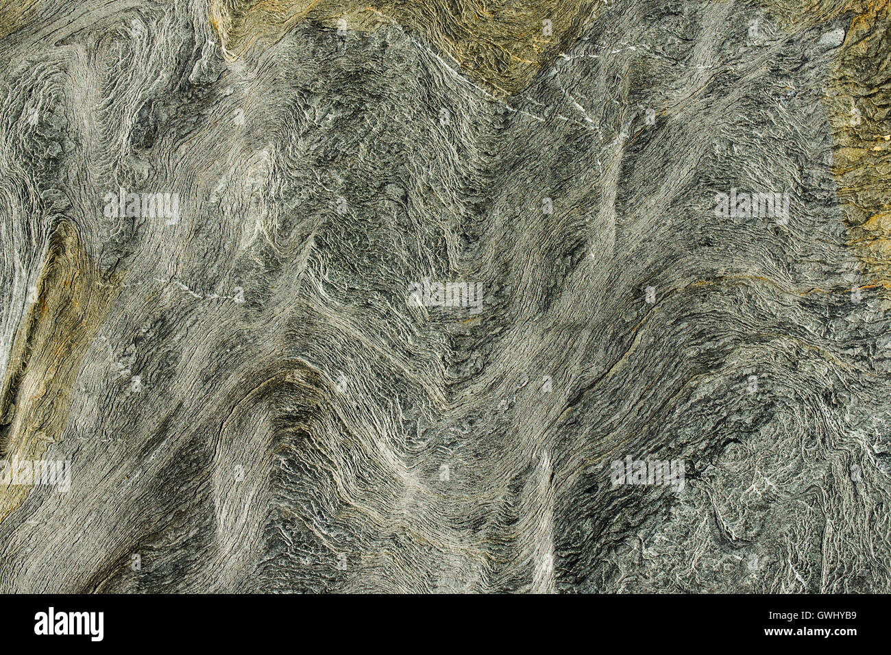 Closeup view of marks, lines and patterns in the eroded surface rock. Stock Photo
