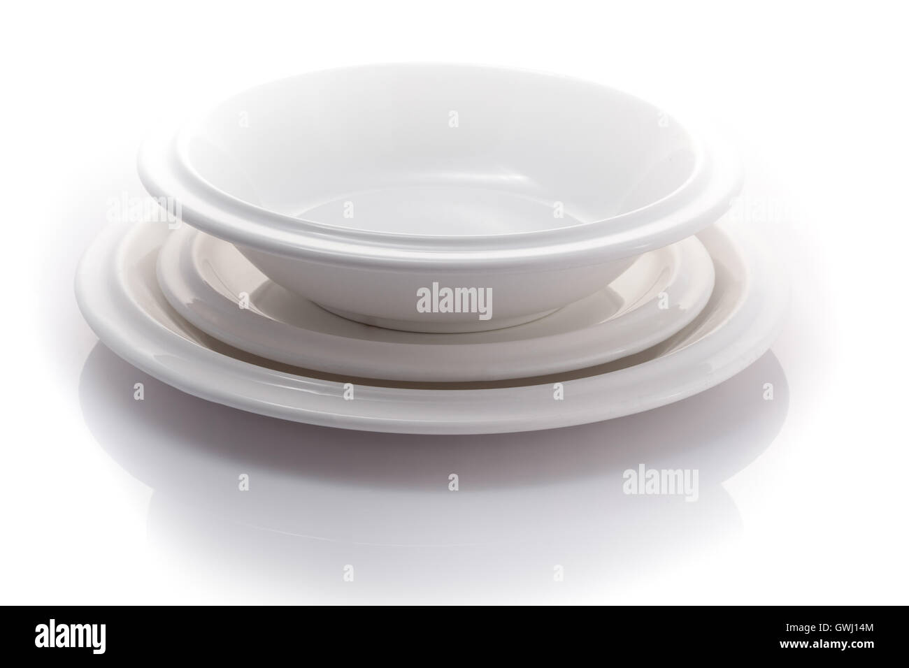 stack of plates isolated on a white background Stock Photo - Alamy