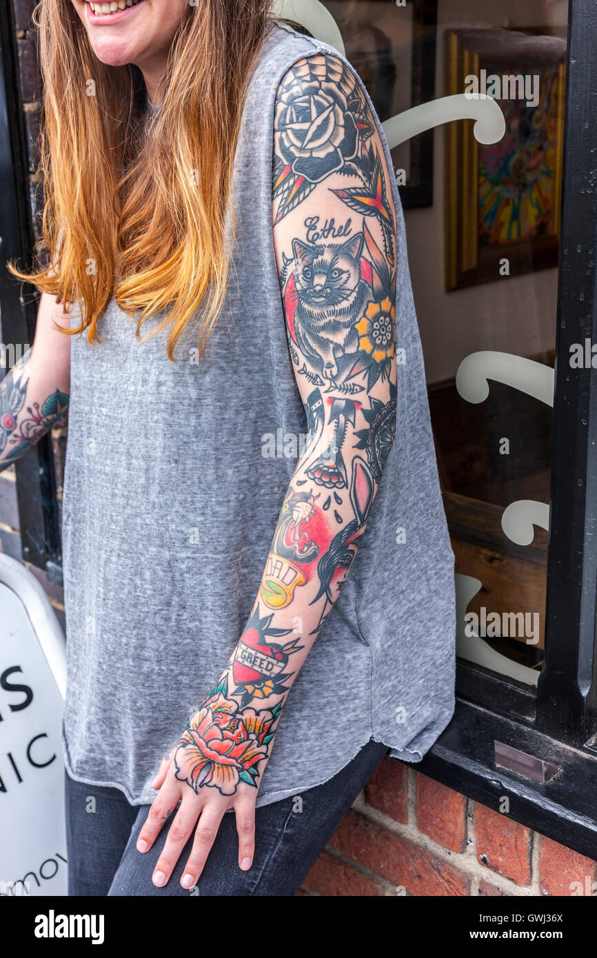 Women with tattoos outside tattoo parlour. Kettering rd, Northampton