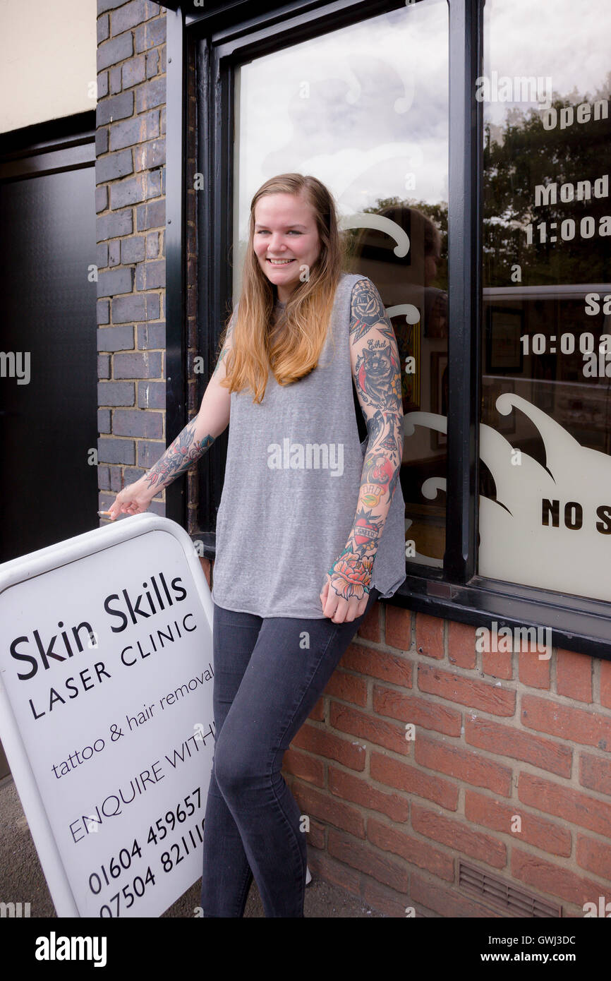 Women with tattoos outside tattoo parlour. Kettering rd, Northampton. U.K. Stock Photo