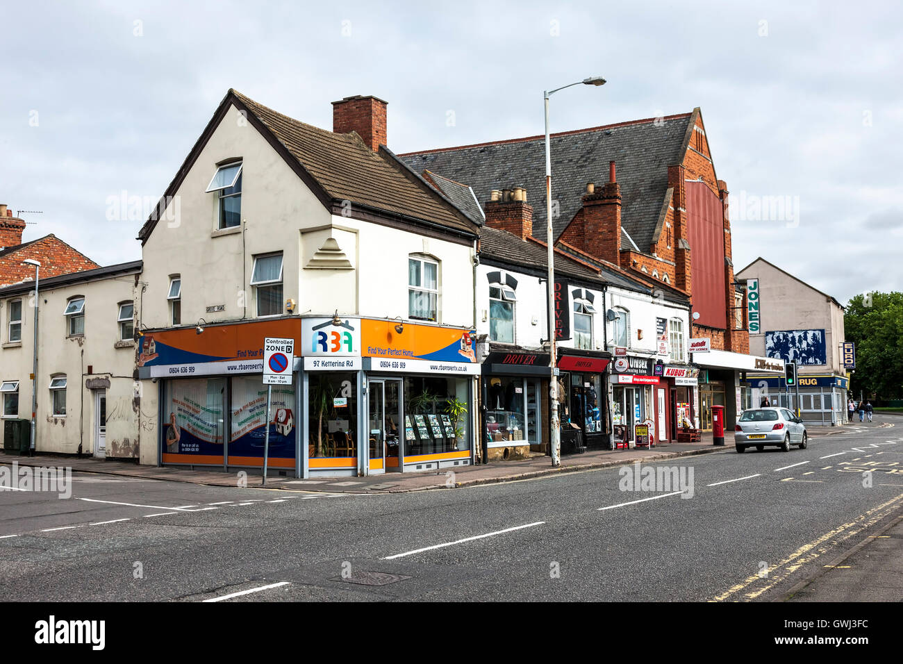 Estate agents and shops on Kettering road Northampton. Stock Photo