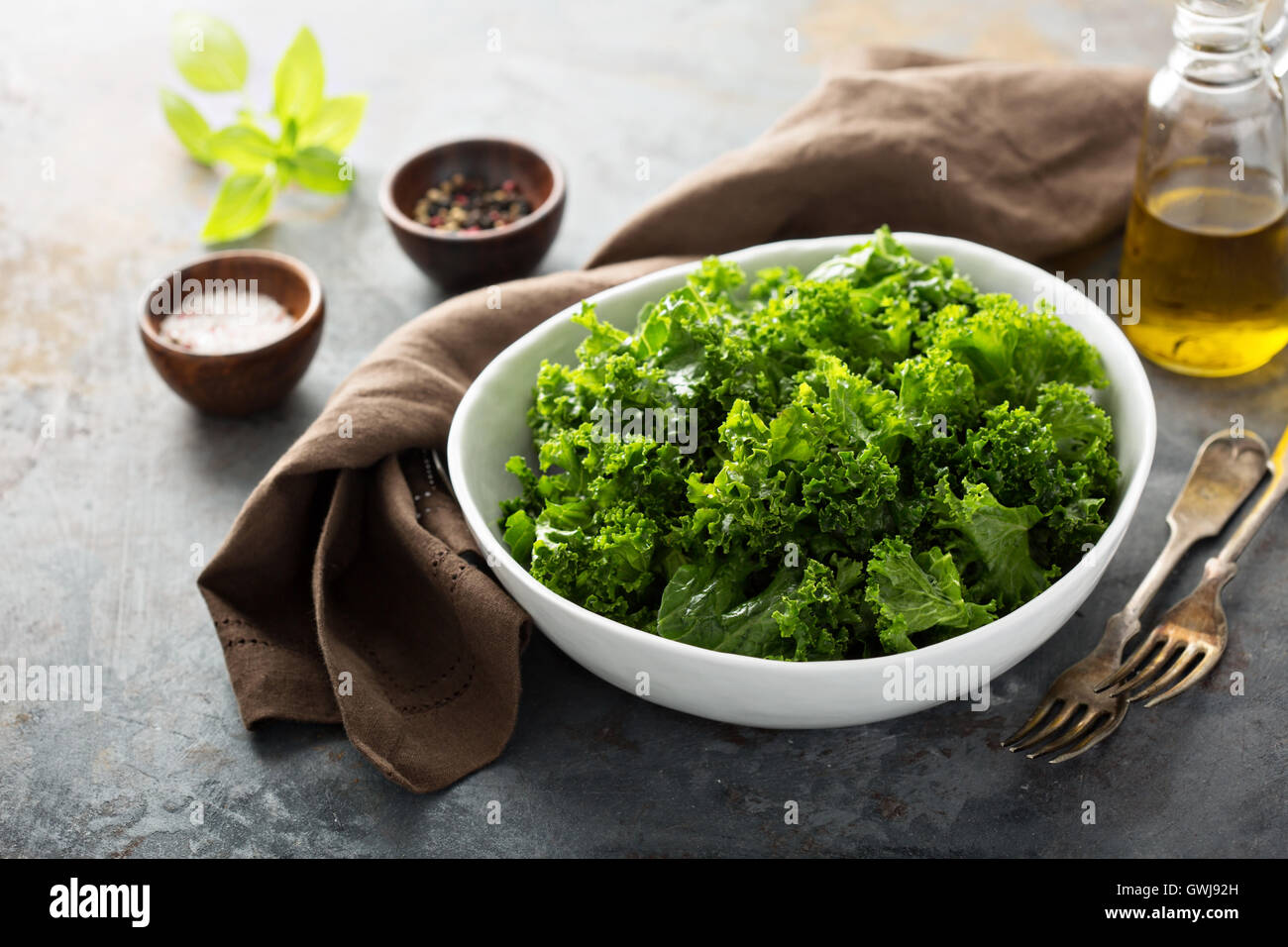 Fresh kale with olive oil, salt and pepper Stock Photo Alamy