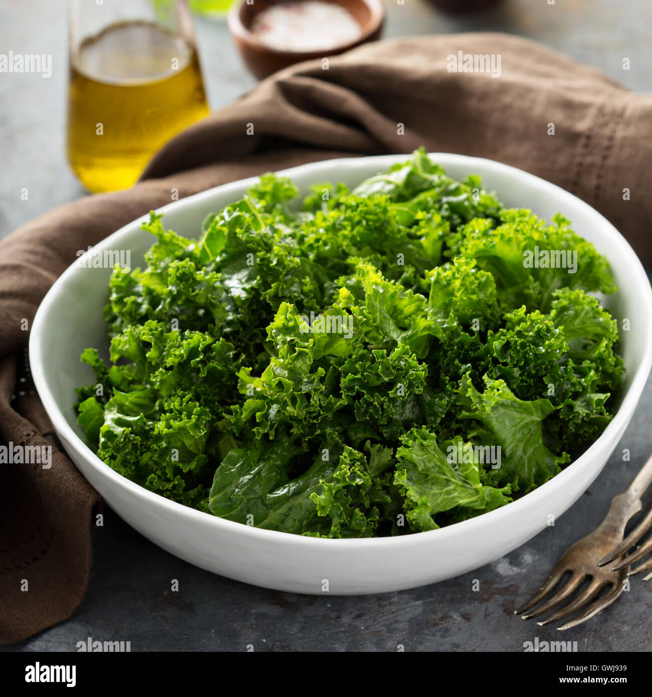Fresh kale with olive oil, salt and pepper Stock Photo Alamy