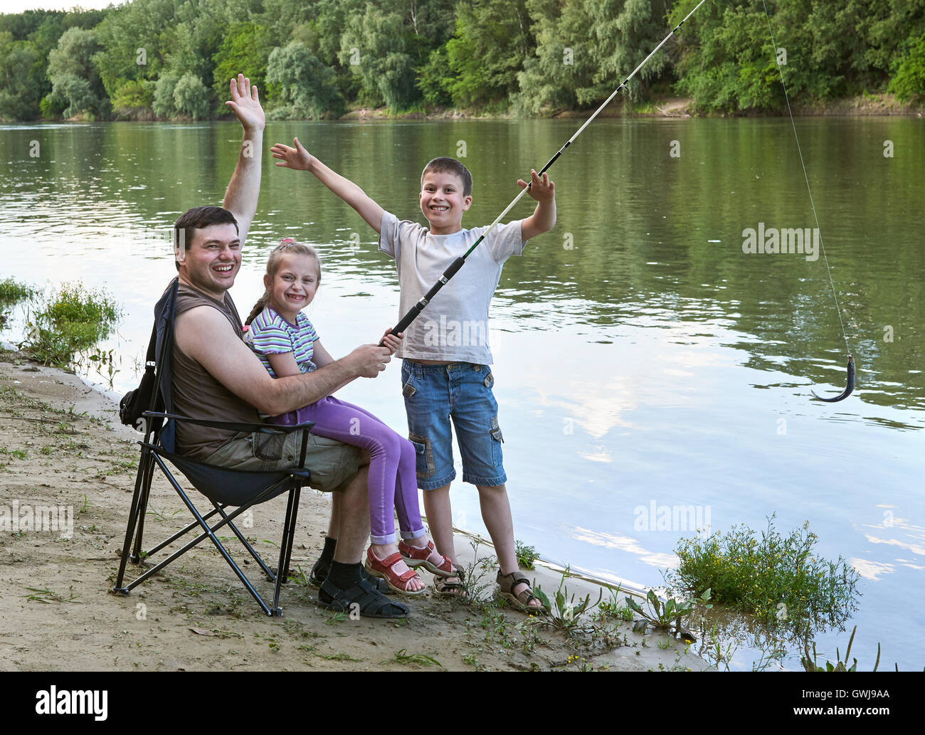 People Camping And Fishing Family Active In Nature Fish Caught On Bait River And Forest Summer Season Stock Photo Alamy