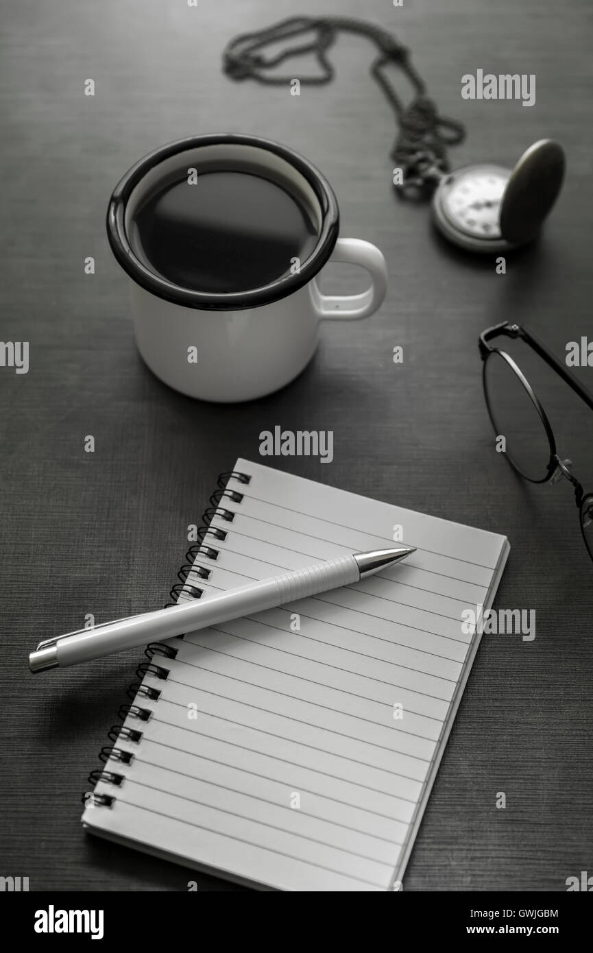 Personal desk with coffee ,notebook  and  watch. Stock Photo