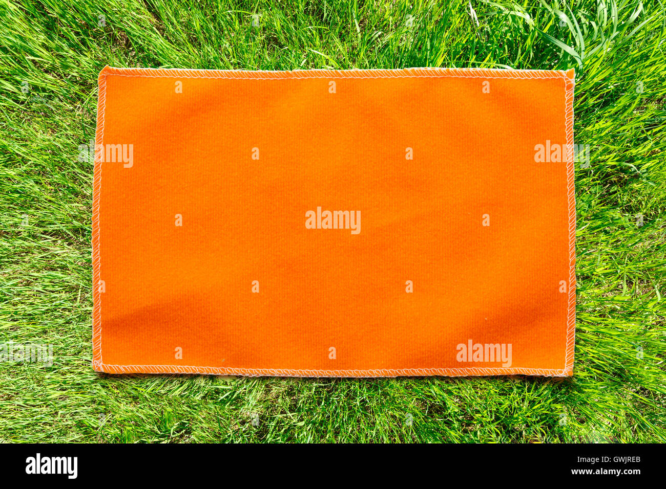 Orange microfiber cloth for glasses in closeup Stock Photo Alamy