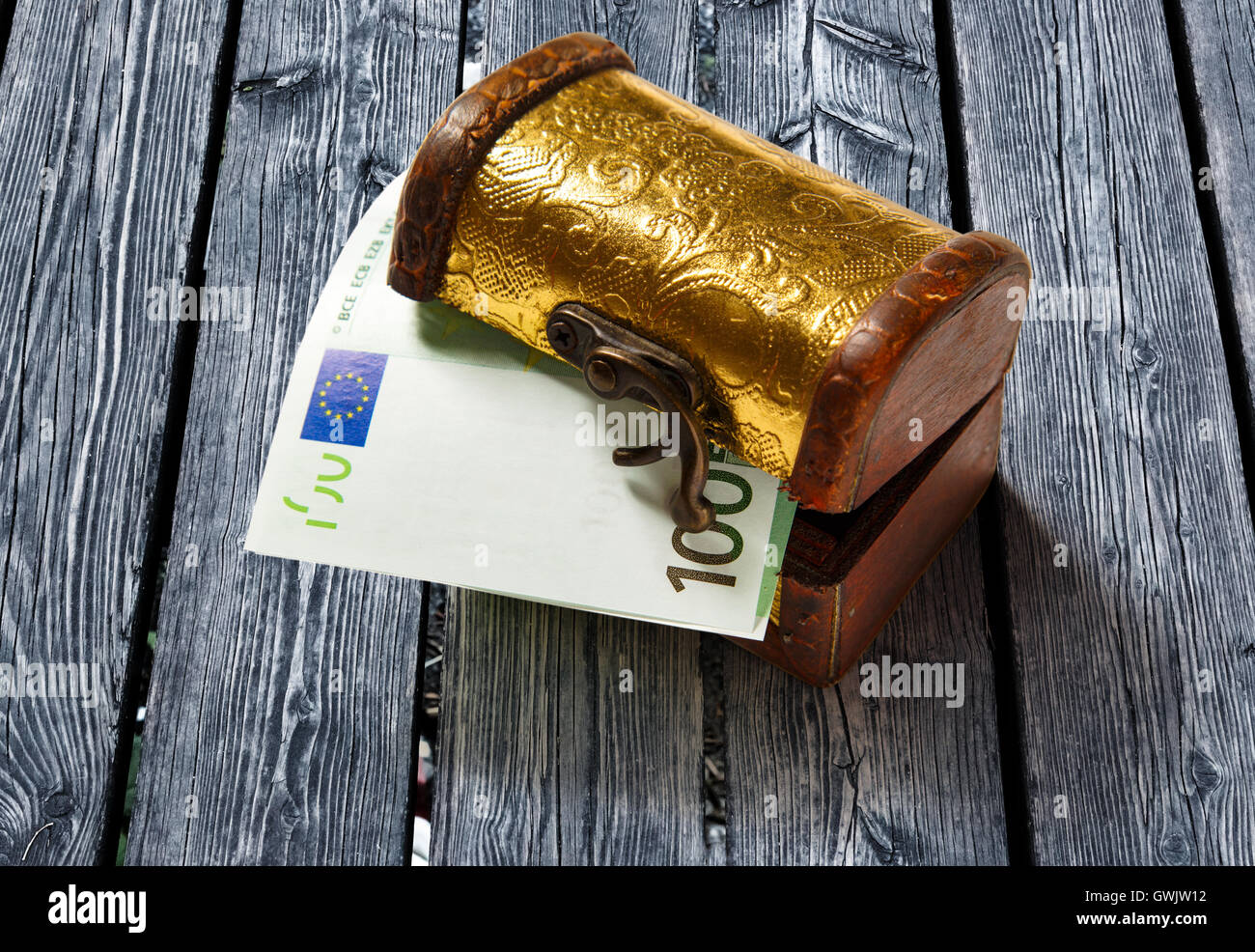 Treasure chest with one hundred euro banknote Stock Photo