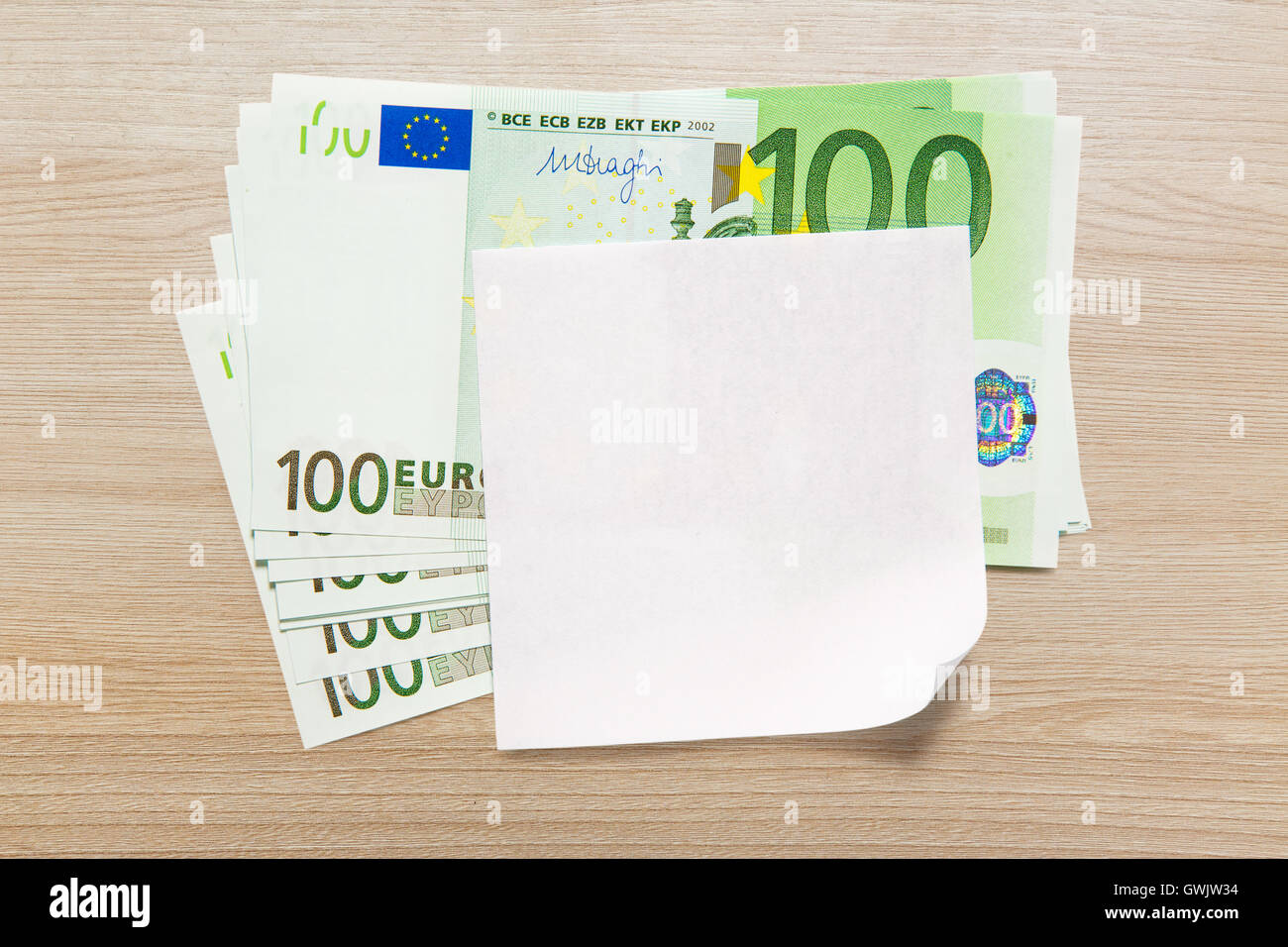 One hundred euro banknotes and blank paper Stock Photo - Alamy