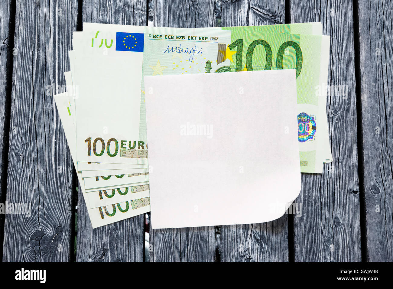 One hundred euro banknotes and blank paper Stock Photo - Alamy