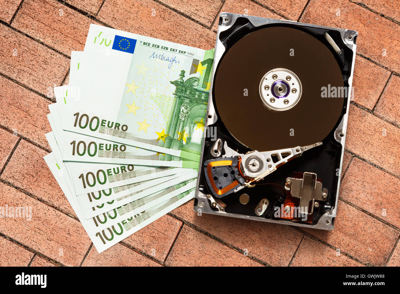 One hundred euro banknotes and hardisk in closeup Stock Photo - Alamy