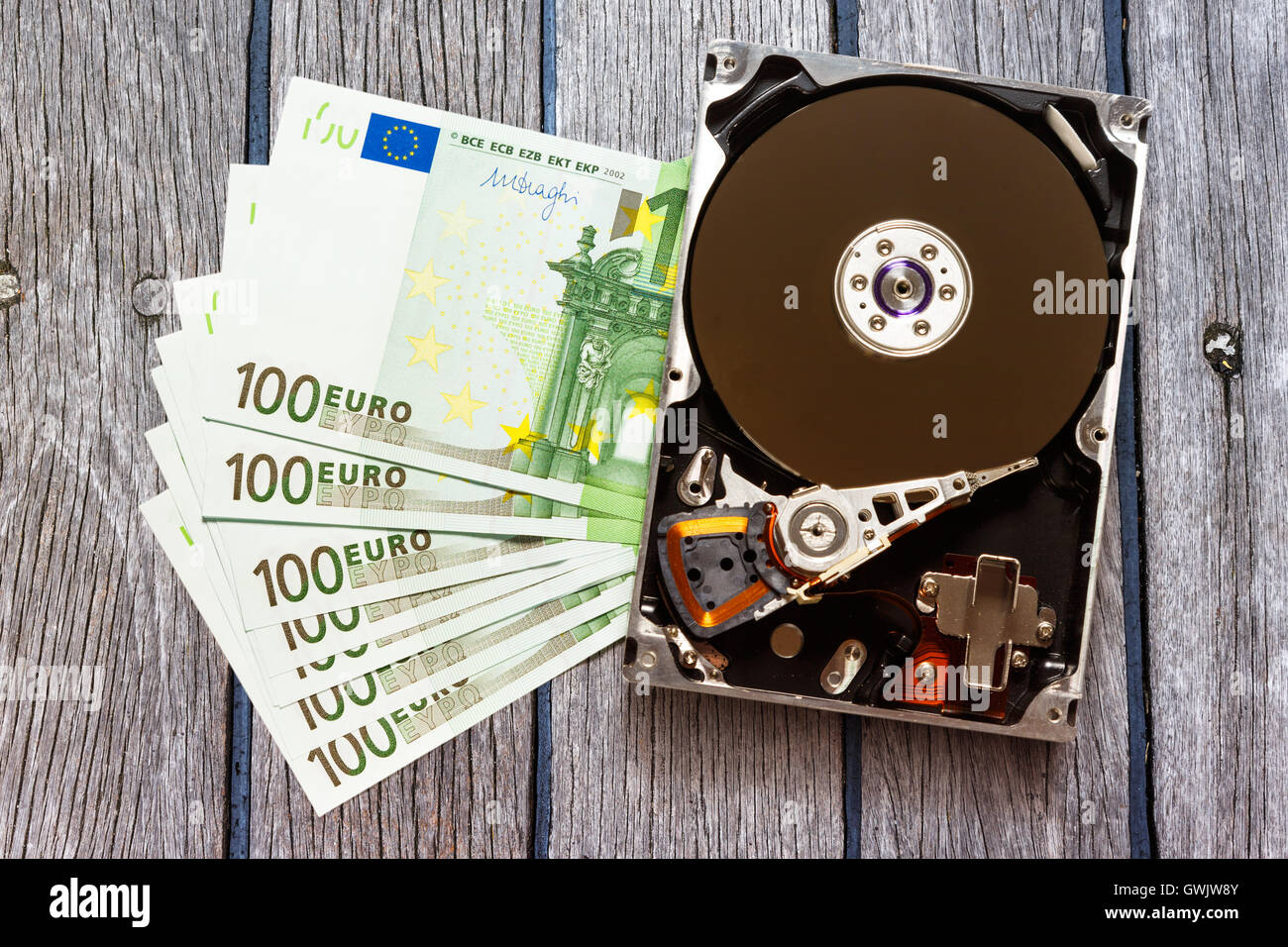 One hundred euro banknotes and hardisk in closeup Stock Photo - Alamy