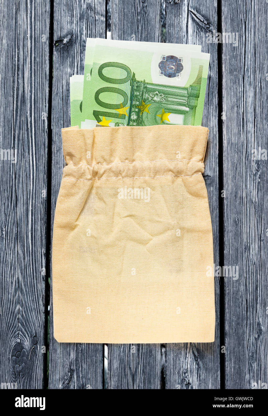 One hundred euro banknotes in linen sack closeup Stock Photo - Alamy