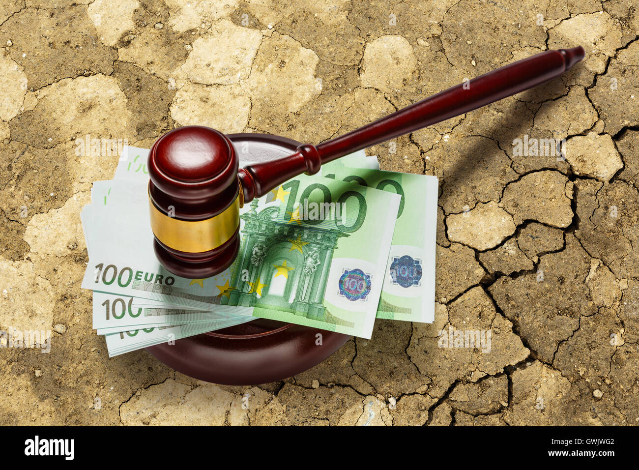 Wooden judge's gavel and one hundred euro banknotes Stock Photo
