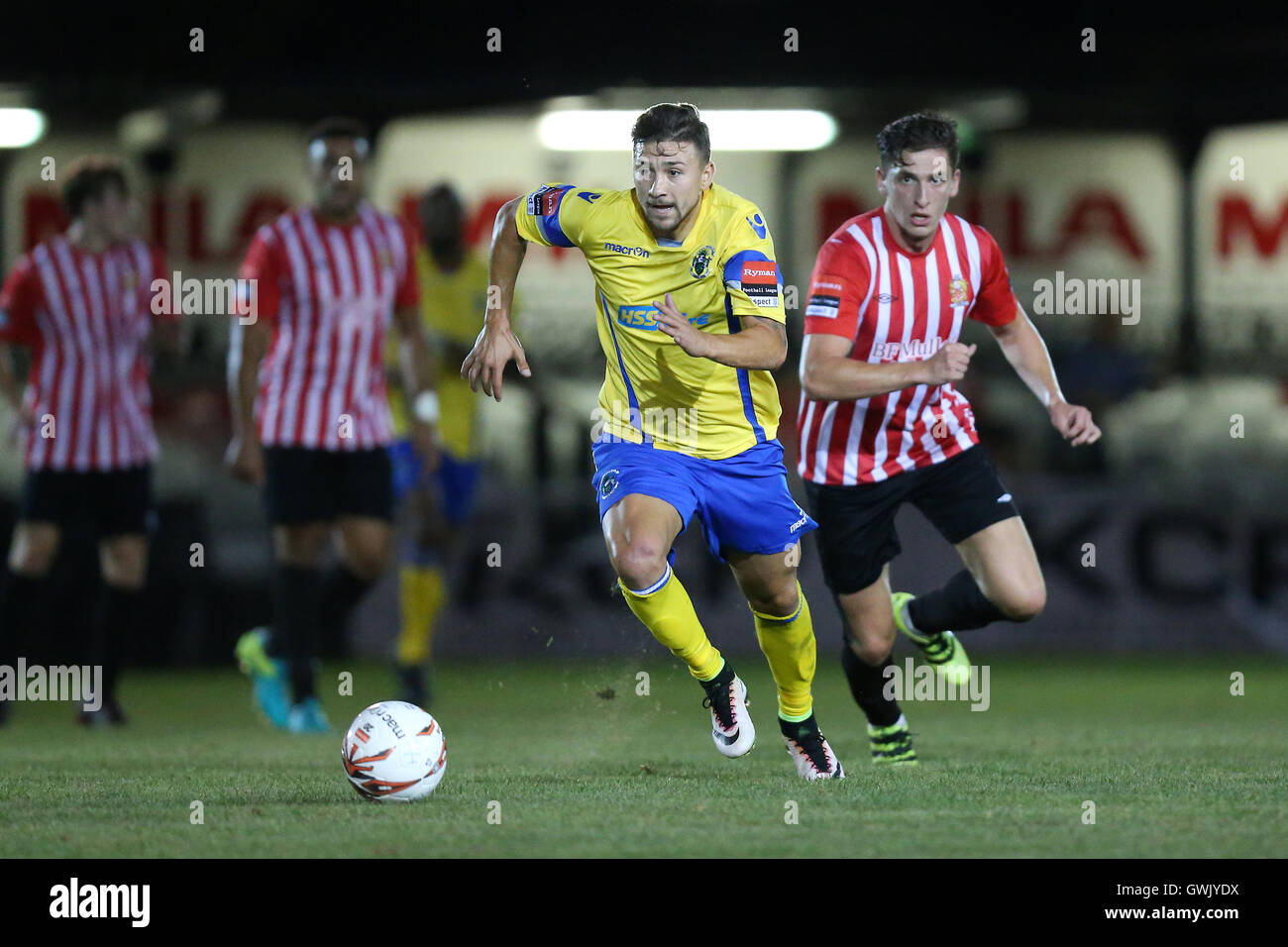 Adrian Markus of Haringey evades Jed Chouman of Hornchurch during AFC