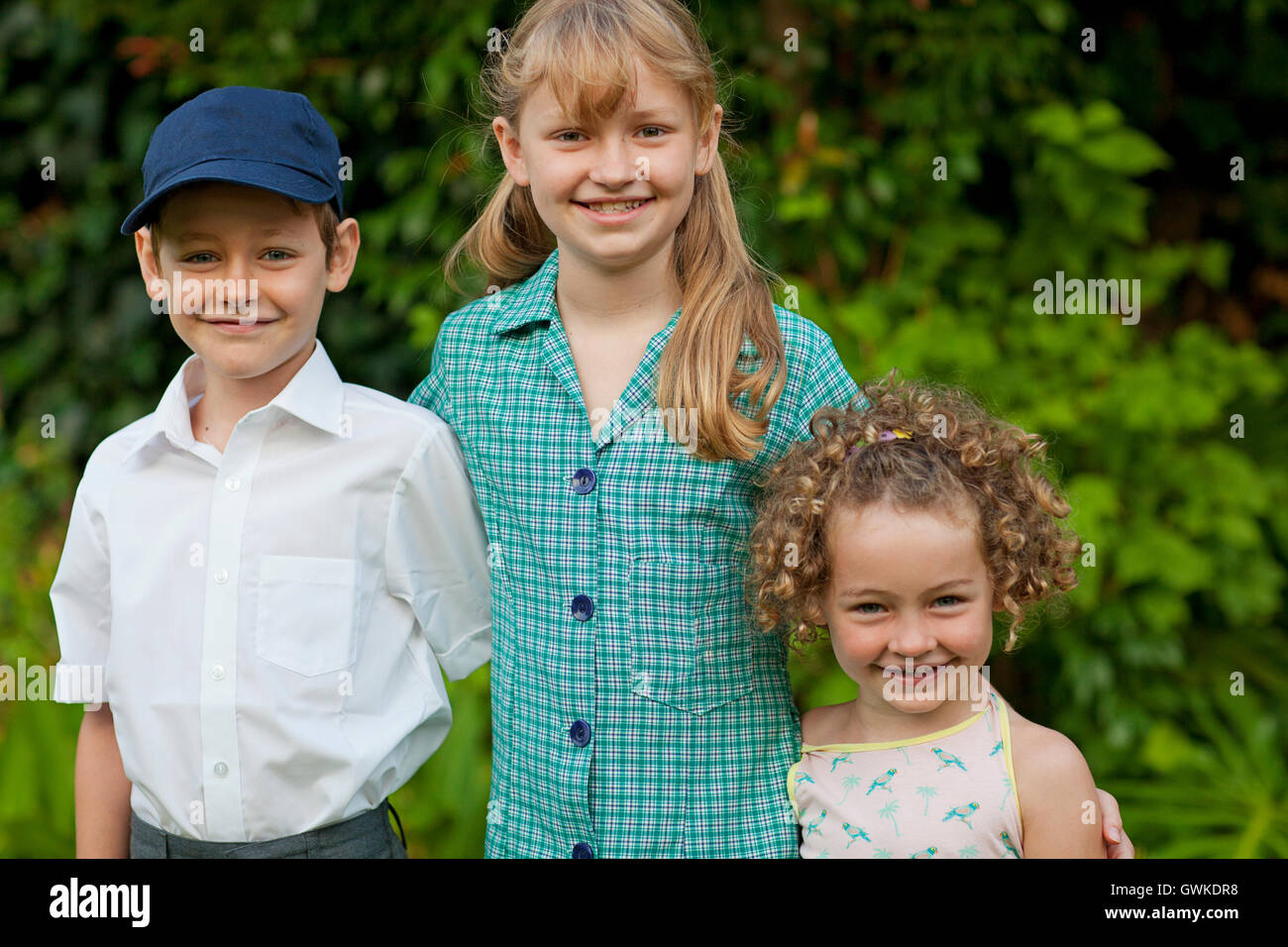 Three smiling school children Stock Photo
