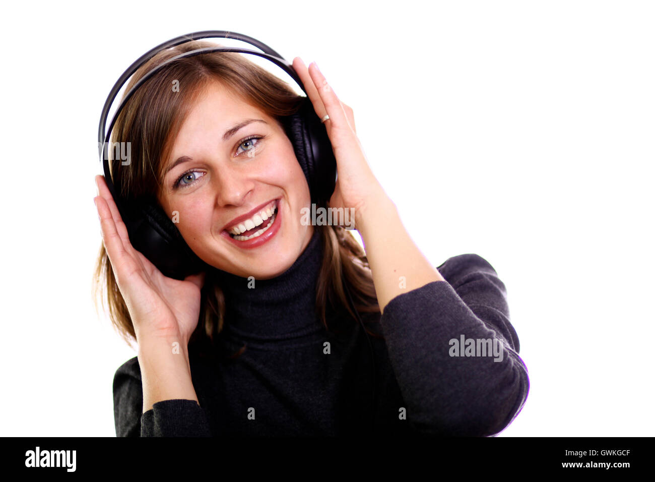 Happy young woman listening to music Stock Photo - Alamy