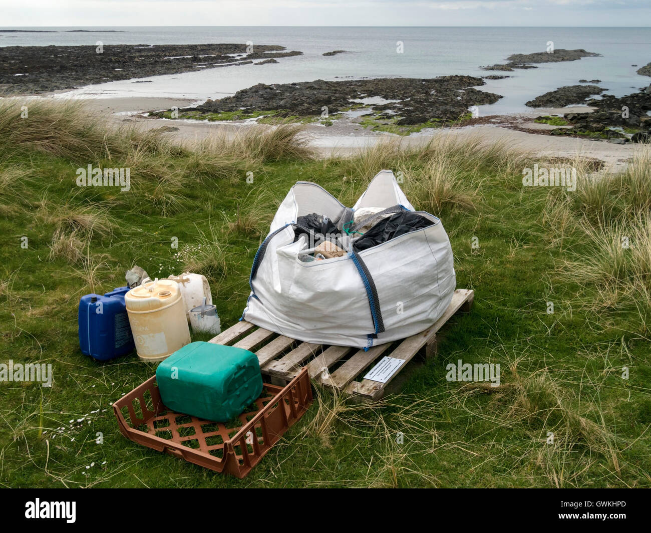 Marine litter collection point by beach, Plaide Mhor, Ardskenish, Isle of Colonsay, Scotland, UK. Stock Photo